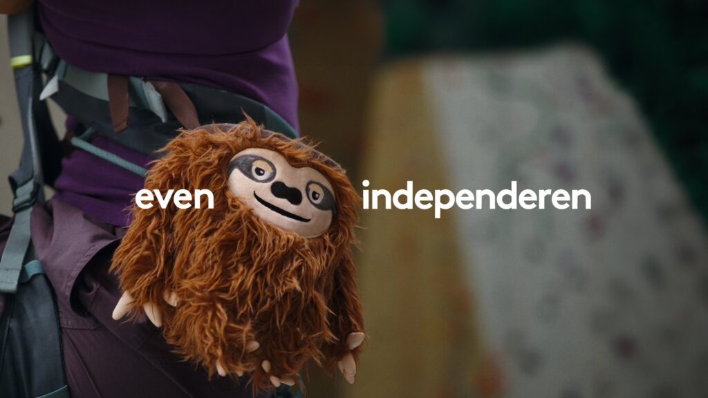 Sloth chalk bag on a climbers harness with the line even independeren in the Independer Why not now campaign by Wolfstreet
